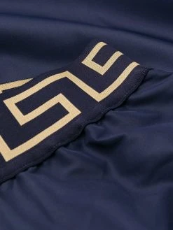 Versace short de bain à bande Greca