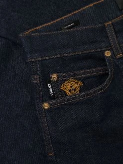 Versace jean droit à motif Medusa brodé
