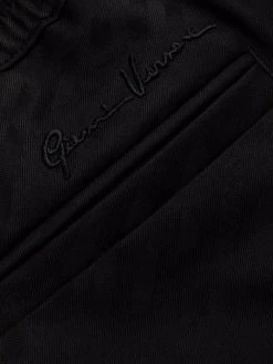 Versace pantalon en satin à logo brodé