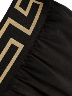 Versace short de pyjama en soie à bordure Greca