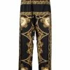 Versace bas de pyjama en soie à imprimé baroque
